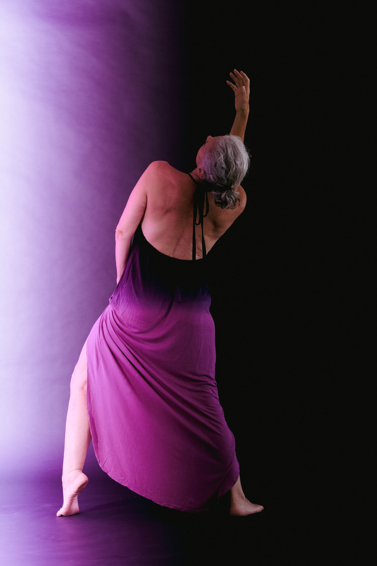 Emmanuelle dancing in violet light